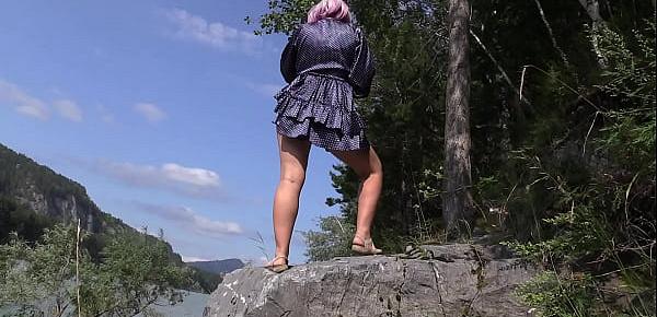  Under the skirt without panties. Voyeur peeks under the dress outdoors and admires hairy pussy and juicy PAWG. Amateur fetish.